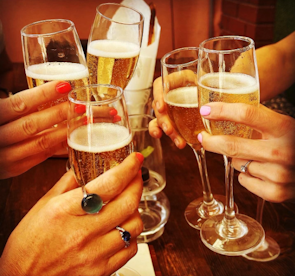 Guests toasting with sparkling drinks